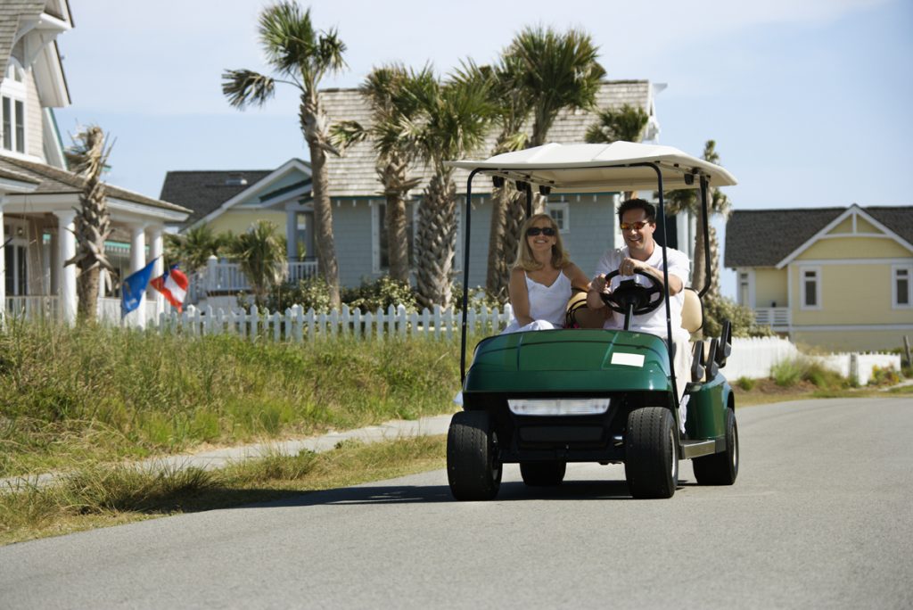 A golf cart on the road near our 30A real estate properties